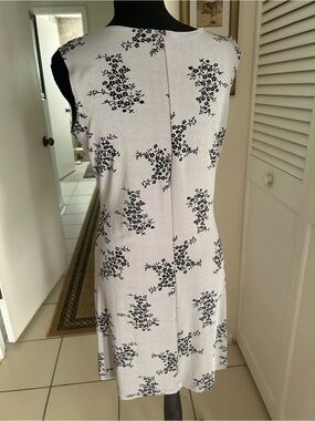 Sleeveless White Mini Dress with Black Floral Print